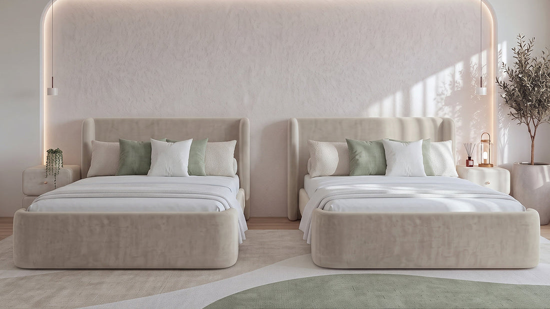 Two cream upholstered beds with sage cushions in bright modern bedroom