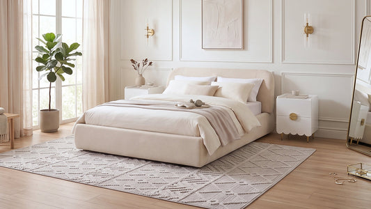 Cream upholstered bed with neutral bedding in elegant bright bedroom