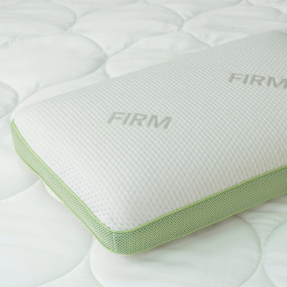 Close-up of the Firm variant's corner, showing the green mesh gusset panel and "Firm" label