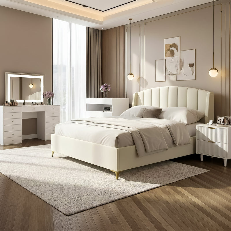 Luxurious master suite with a cream vertical-tufted bed, fluted white nightstands, and a professional vanity station with a lighted mirror.
