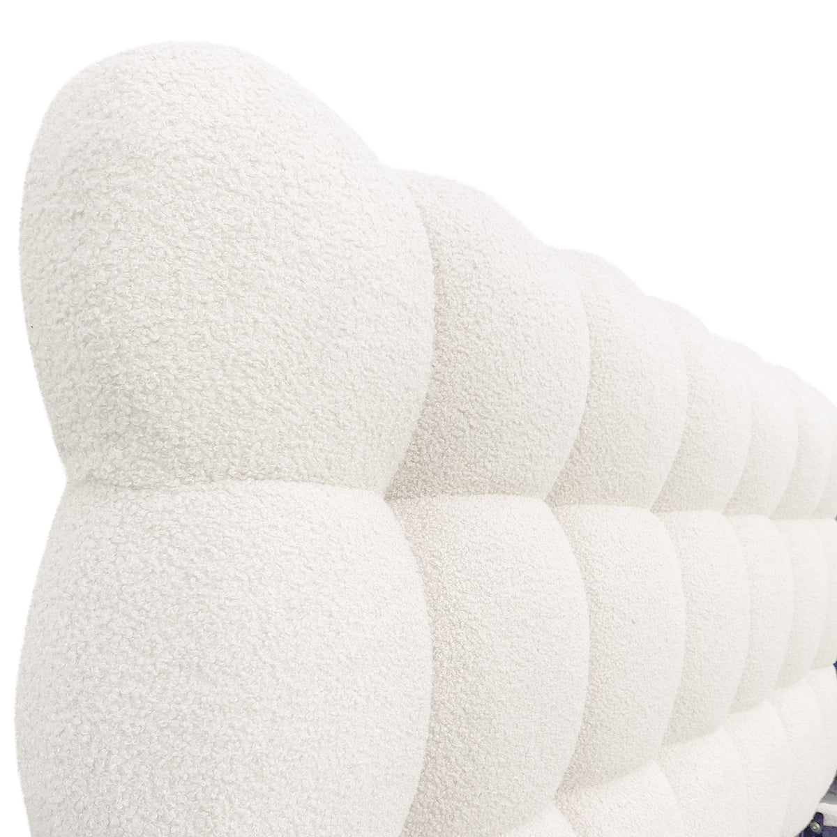 Aina Double Boucle Bed Frame in Cream White features a close-up of its tufted, pillowy headboard with a nubby bouclé texture, showcasing luxurious and elegant craftsmanship.