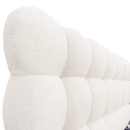Aina King Bouclé Bed Frame in Cream White features a close-up of tufted bouclé upholstery, highlighting the soft, rounded grid pattern of the headboard's plush surface.