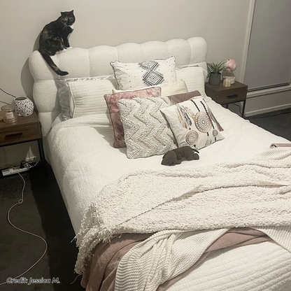 Aina King Boucle Bed Frame in Cream White with scalloped tufted headboard, styled with white bedding and textured cushions