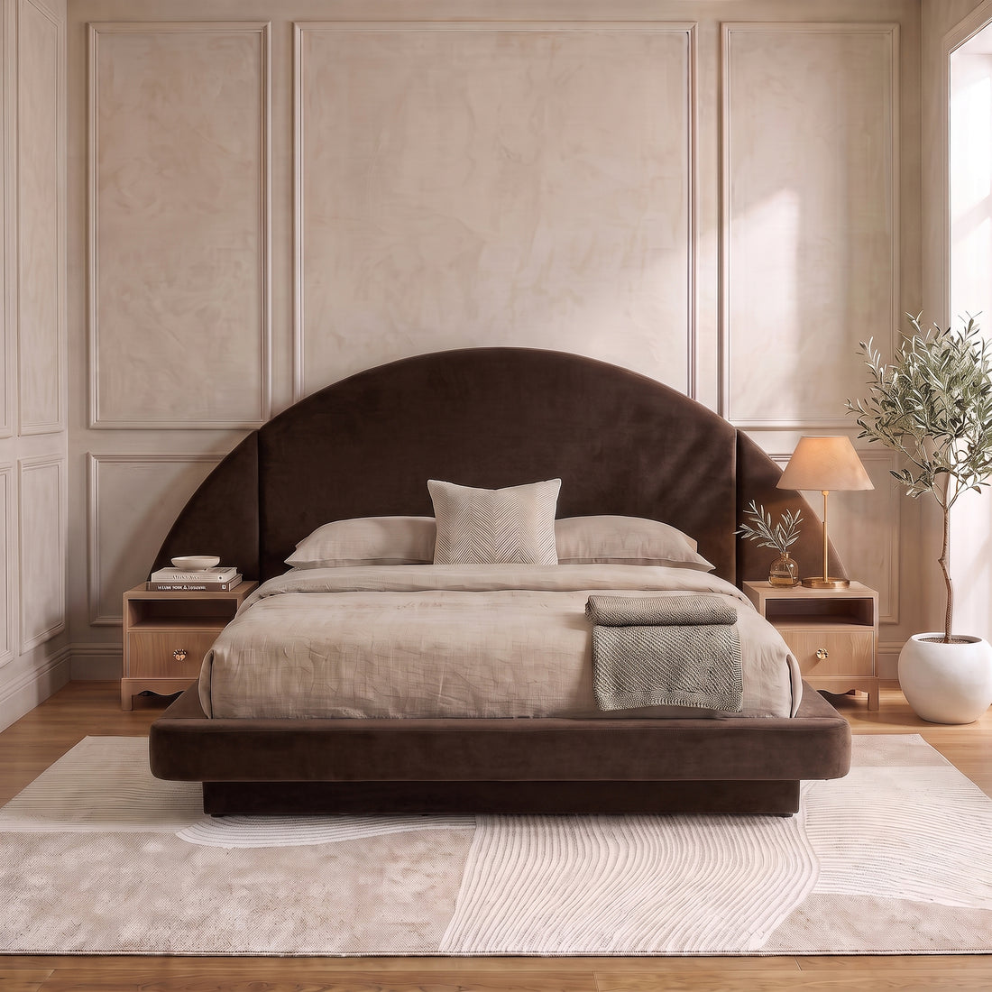A modern neutral bedroom showcasing a dark brown velvet bed frame with an oversized half-moon headboard, styled with beige bedding and wooden nightstands on a textured abstract rug.