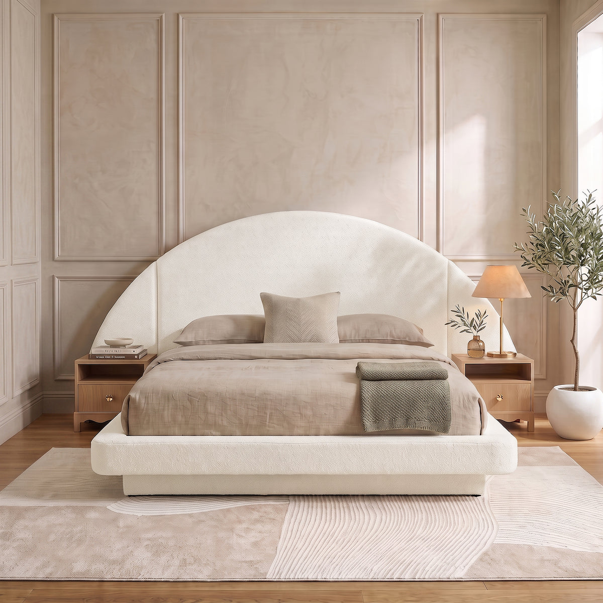A modern neutral bedroom featuring  Cosy Bouclé Bed Frame, flanked by wooden nightstands on an abstract area rug.