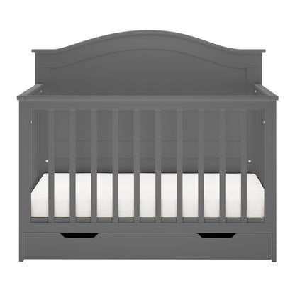 Azeem 3-in-1 Adjustable Solid Pine Baby Cot Grey with vertical slats, arched headboard, white mattress, and pull-out storage drawer, showcasing its convertible design and solid pine craftsmanship.