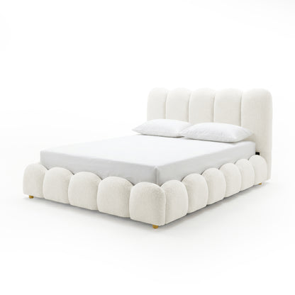 Brent double gas lift bed in boucle cream white with scalloped base, channel-tufted headboard, and gold legs