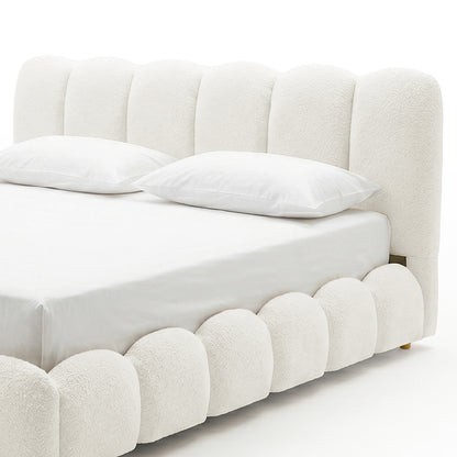 ream boucle bed frame with scalloped headboard and white bedding