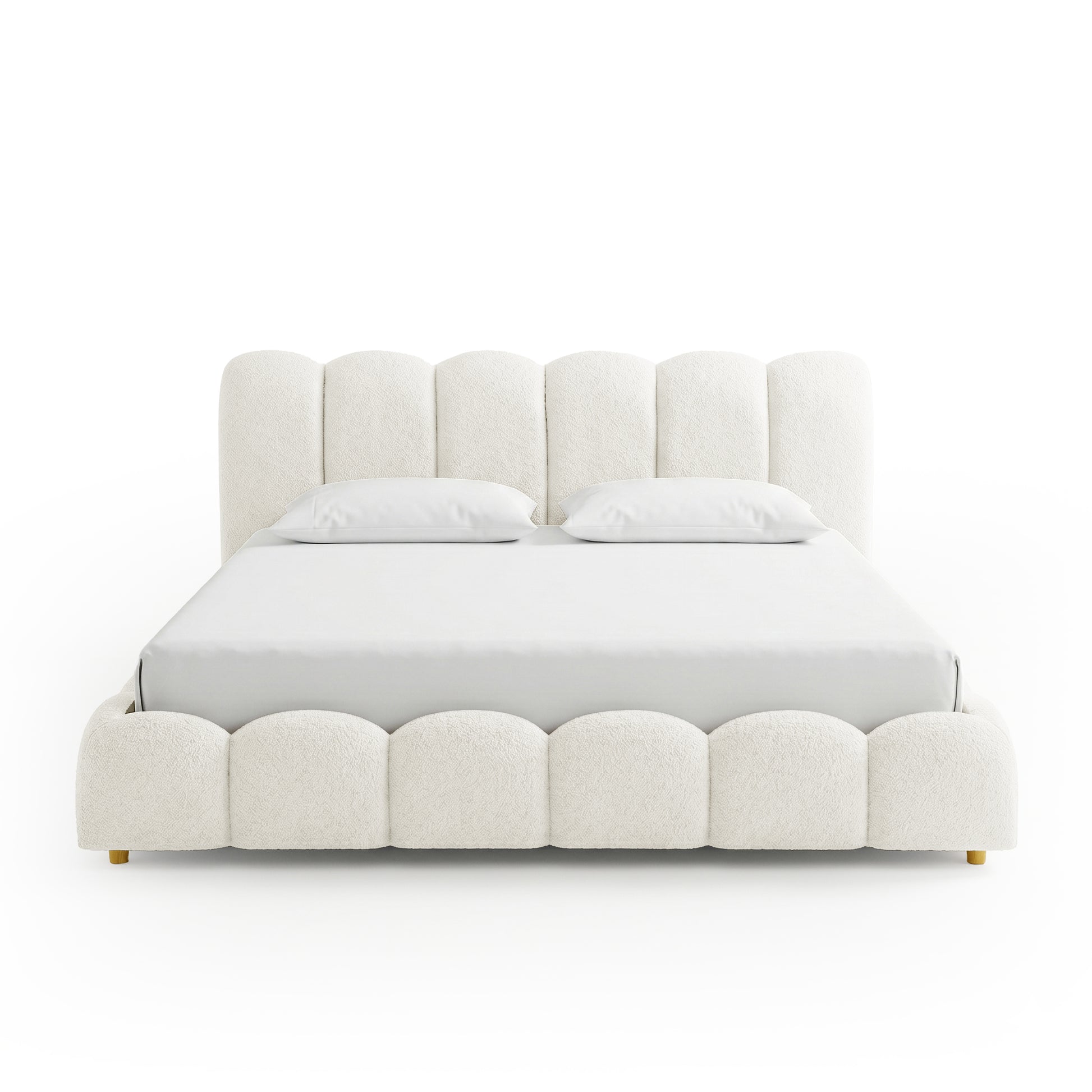 Cream boucle bed frame with scalloped headboard and white bedding