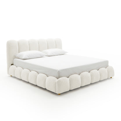 Brent King Gas Lift Bed in Boucle Cream White with scalloped base and vertical channel tufted headboard, shown with white