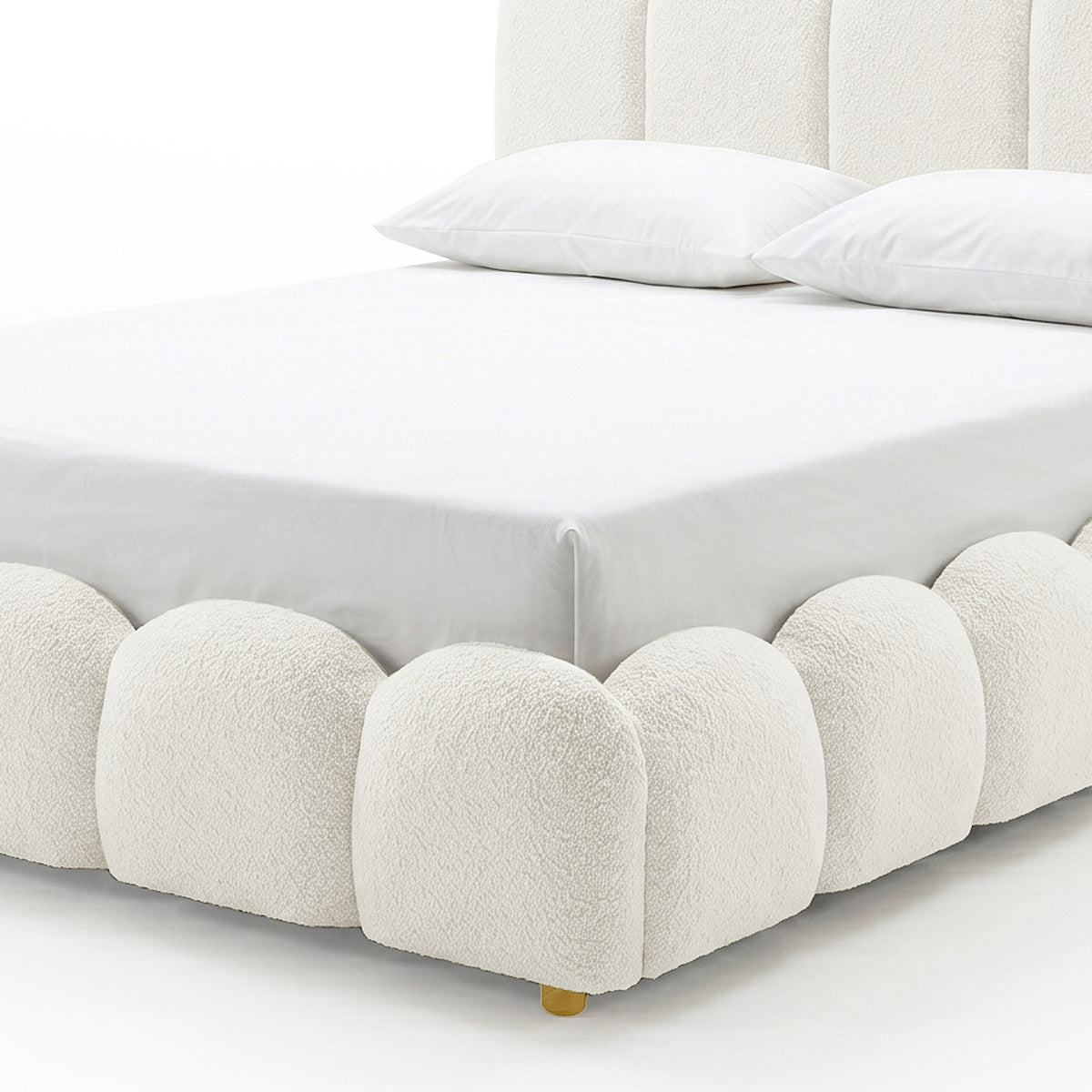 Brent Queen Gas Lift Bed in cream white boucle fabric with scalloped base and brass leg detail, shown with white bedding