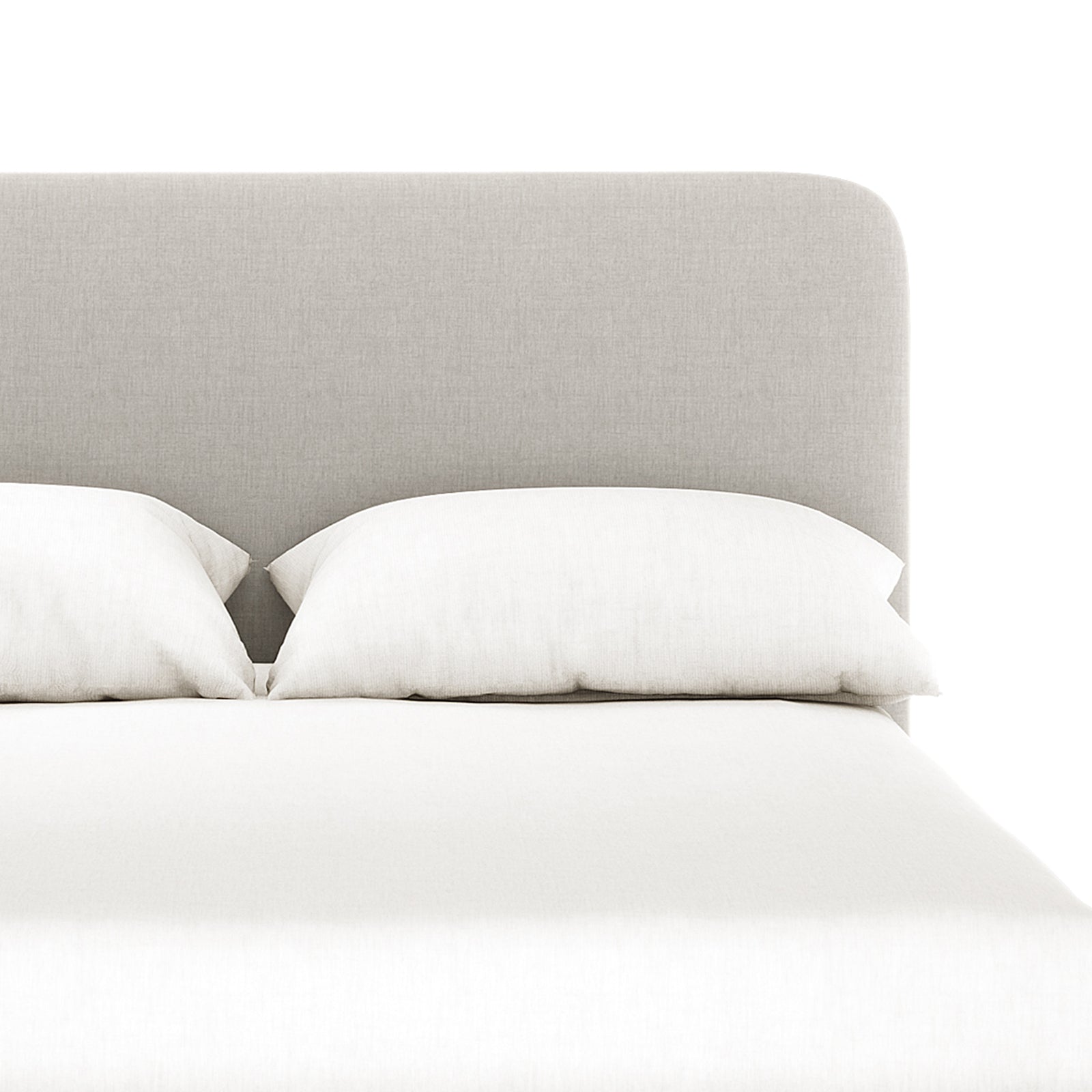 Grey upholstered bedhead with curved corners, white pillows and white bed linen