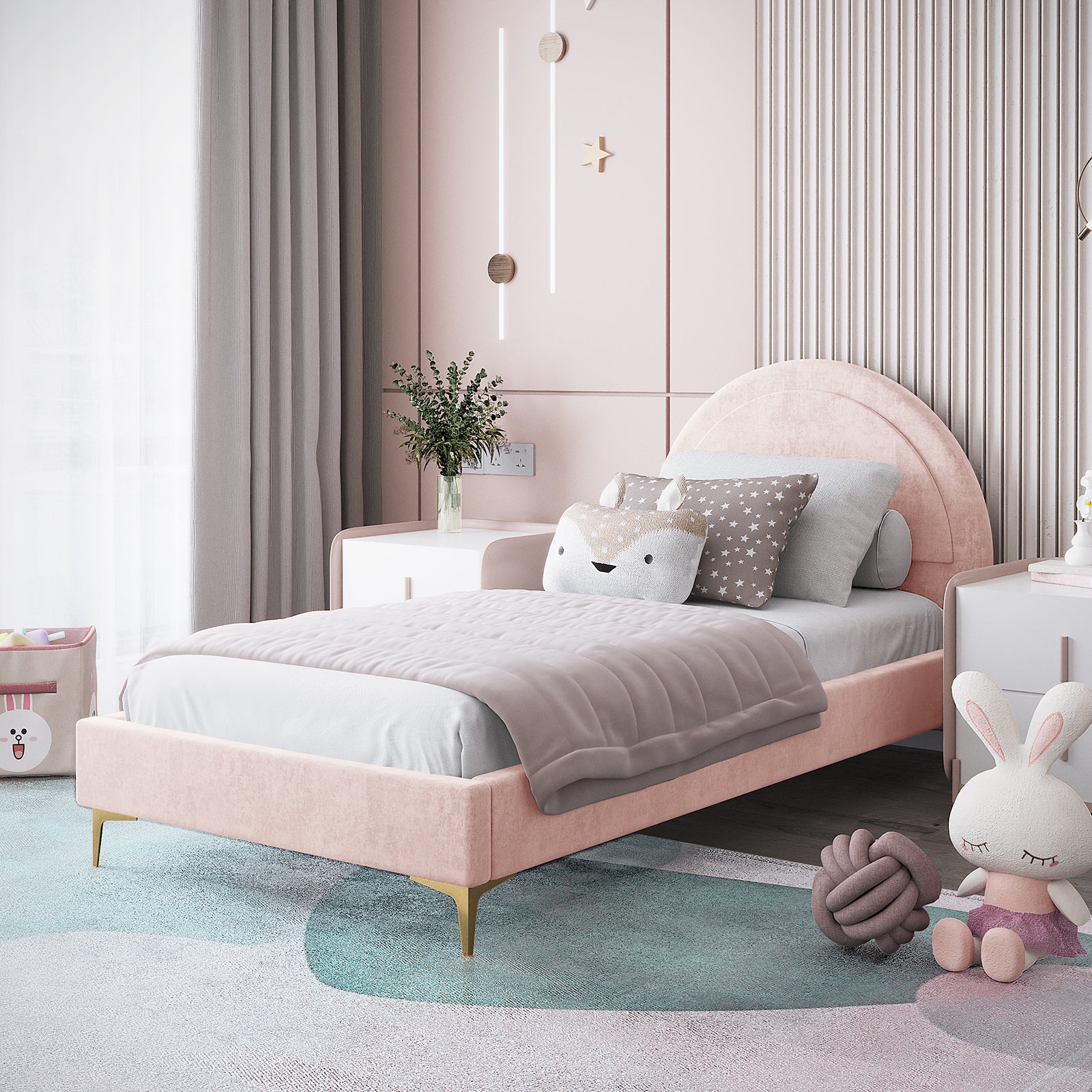 Camryn Kids Single Velvet Bed Frame in Soft Pink features a blush-pink velvet finish with a rounded headboard, light gray sheets, decorative pillows, and pastel accents, creating a cozy, modern nursery corner.