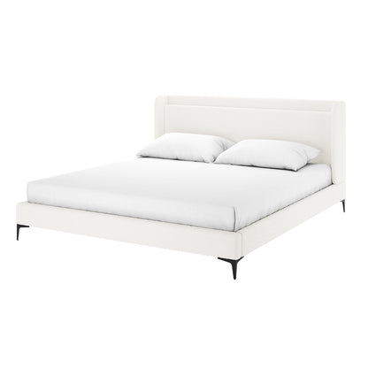Cream white boucle king bed frame with winged headboard, black tapered legs, white mattress and two white pillows