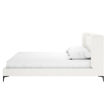 Cream white boucle king bed frame with winged headboard, white fitted sheet, white pillow, black tapered legs