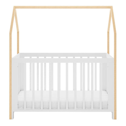 Damaris & Giro Solid Pine Baby Cot with Convertible Rail Set White features a white slatted base with natural wood posts, forming a house-shaped frame, highlighting its whimsical and adaptable nursery design.