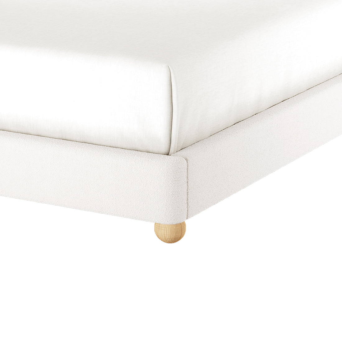 Ginnie Bouclé Curved King Bed Frame - Cream White; close-up of white fabric frame with white mattress, on a round wooden foot, showcasing the elegant bouclé texture and sturdy construction.