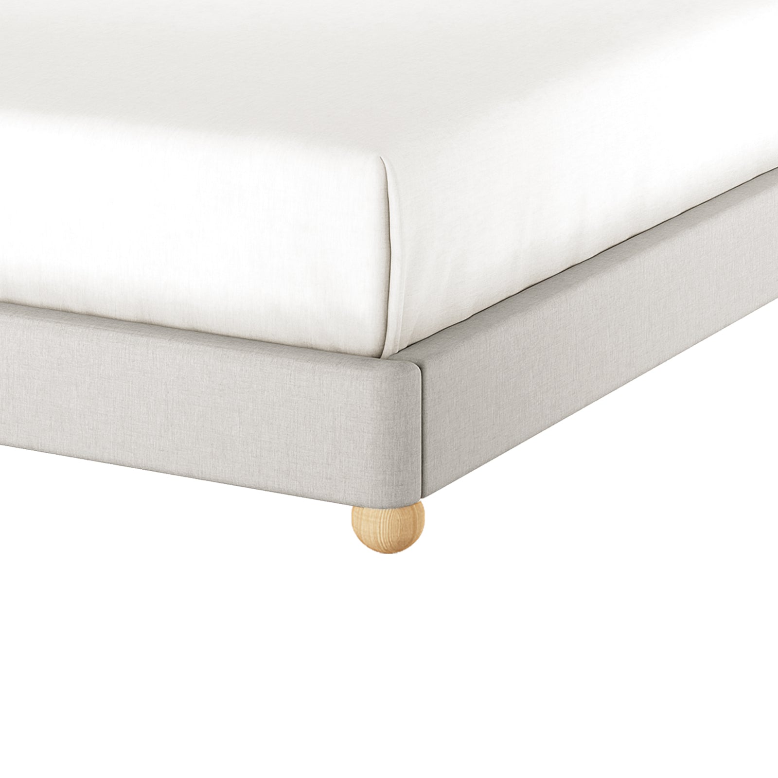 Close-up of the Ginnie Linen Curved Queen Bed Frame - Grey, showcasing the light-gray upholstered frame with a rounded wooden leg, and a mattress covered with a fitted white sheet.