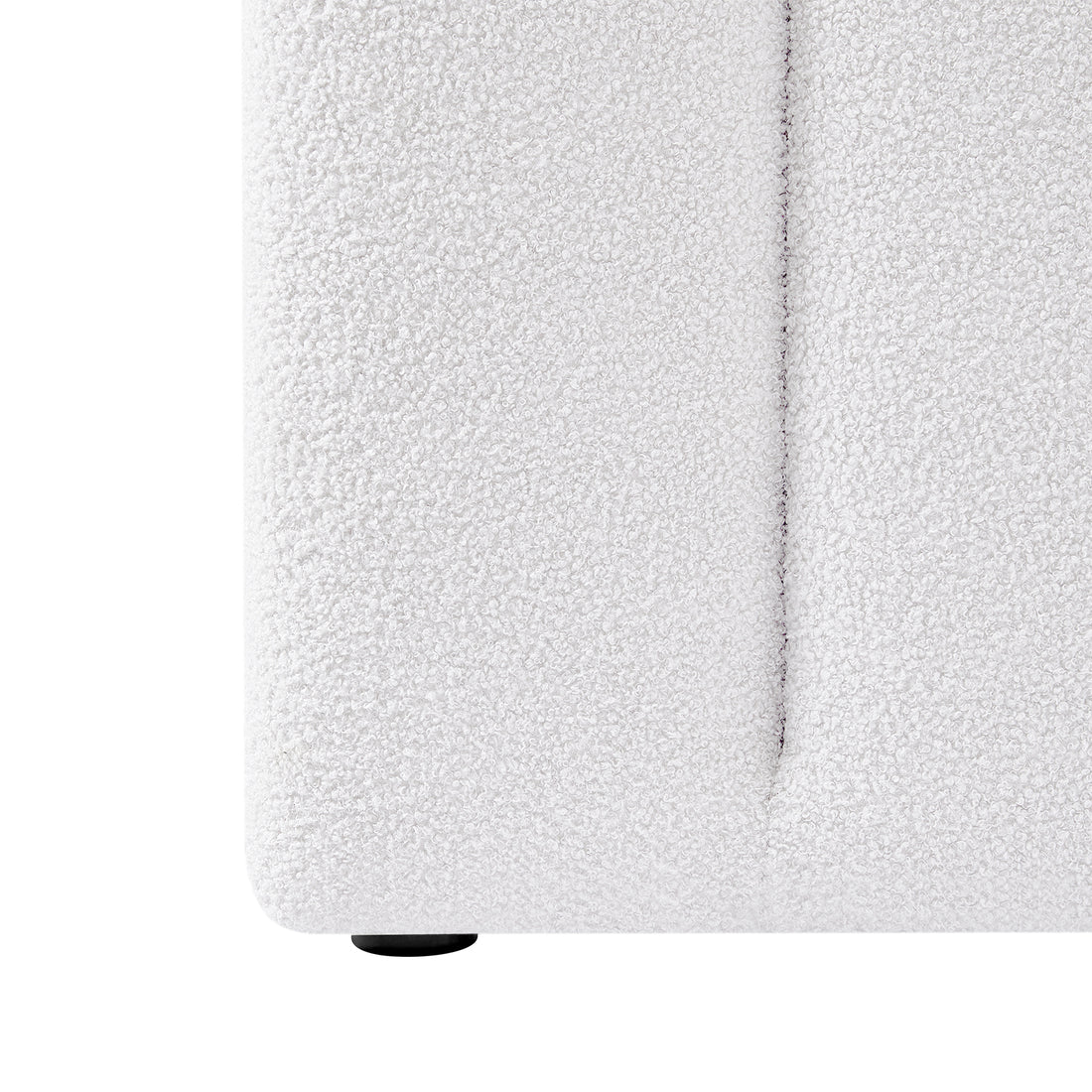 Close-up of the Aquila & Fabia Bed Package - Cream White King, showcasing the boucle-textured upholstery on the lower corner and a small round black foot, emphasizing luxury and style.