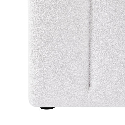 Close-up of the Aquila & Fabia Bed Package - Cream White King, showcasing the boucle-textured upholstery on the lower corner and a small round black foot, emphasizing luxury and style.