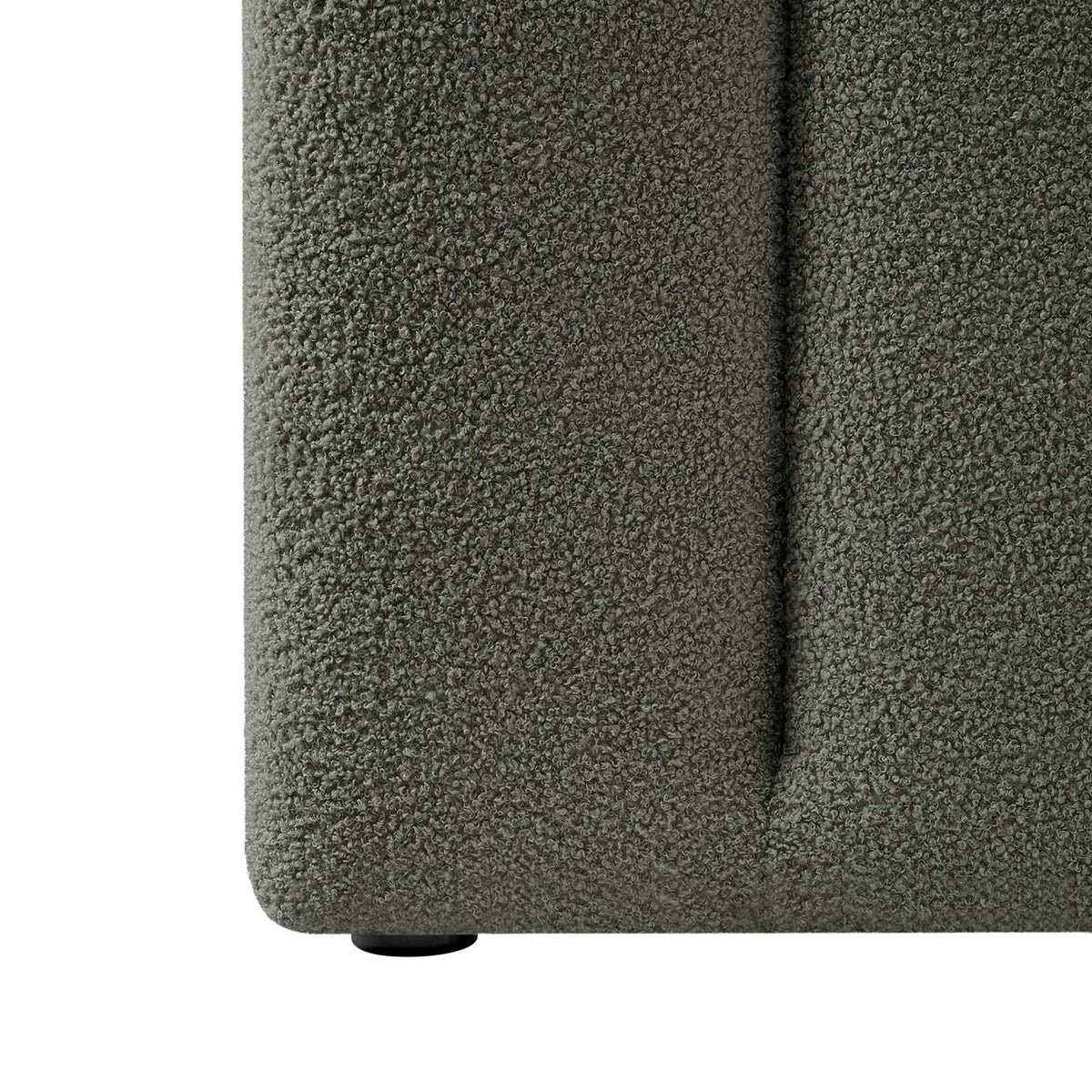 Close-up of Aquila Queen Boucle Headboard & Fabia Storage Bed Base Set in Green, featuring muted green boucle fabric and a small round plastic foot visible beneath.