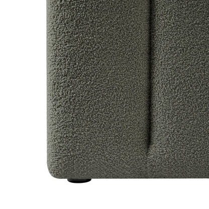 Close-up of Aquila Queen Boucle Headboard & Fabia Storage Bed Base Set in Green, featuring muted green boucle fabric and a small round plastic foot visible beneath.