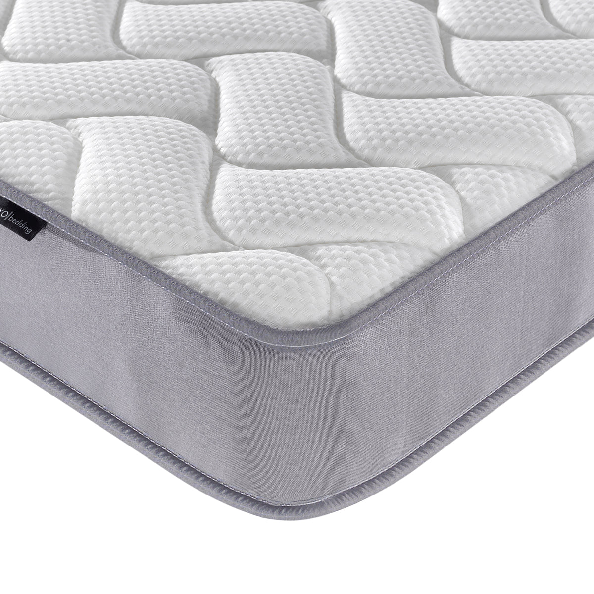 Close-up of the Harel & Vesta Slide Bunk Bed & Vesta Mattress Set in Natural, highlighting the quilted Vesta mattress corner with padded white surface and grey side panel for optimal comfort.
