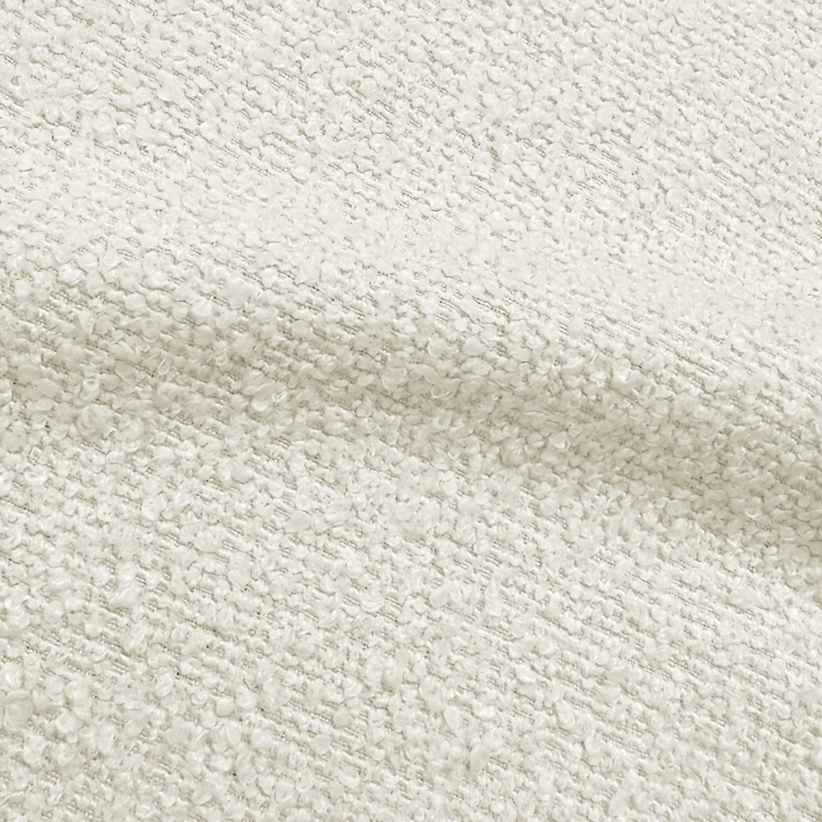 Close-up of cream white boucle fabric texture showing woven looped pattern