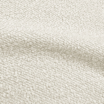 Close-up of cream white boucle fabric texture showing woven looped pattern