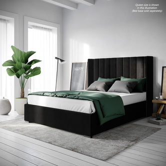 Fulvia Queen Winged Velvet Fabric Headboard in Ink, featuring vertical channel tufting with a solid wood frame, complements a stylish bedroom setting with white sheets and green comforter.