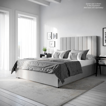 Gratiana Double Velvet Fabric Headboard in Slate features a tall, vertically channeled design with elegant stitching, set against a modern bedroom with grey-toned bedding and minimalist decor.
