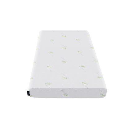 White junior mattress with green leaf pattern and rounded corners