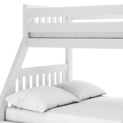Kourtney Hardwood Triple Bunk Bed with Drawers in White features an upper bunk safety rail, angled lower bunk support, and slatted headboard, with two light-gray pillows on the lower mattress.