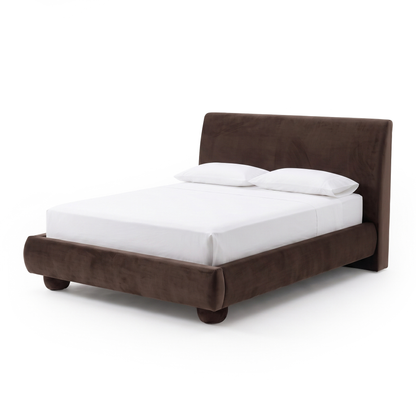 Full upholstered bed with white bedding on a white background