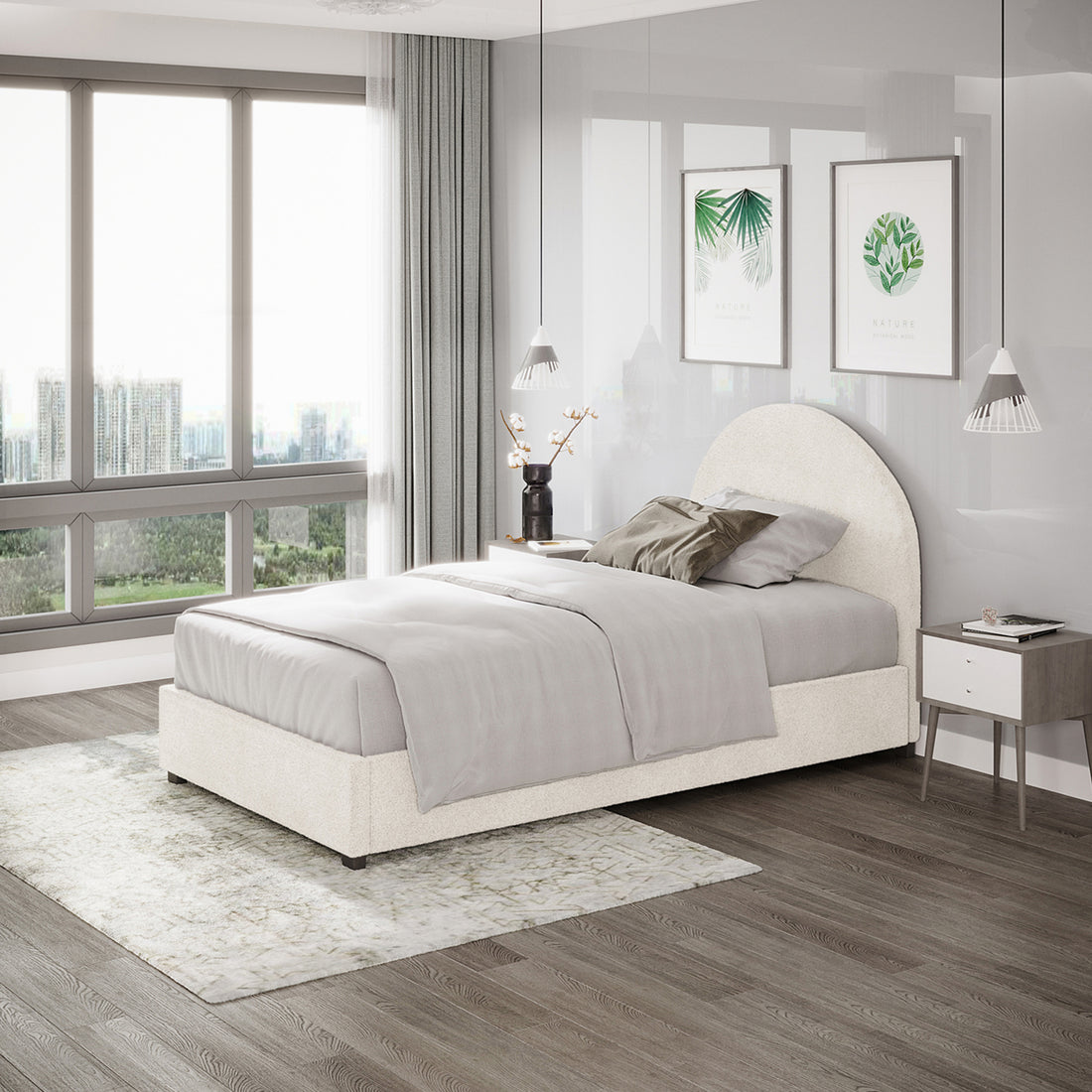 Lunia King Single Bouclé Bed Frame with Gas Lift Storage in cream white, featuring elegant bouclé upholstery, a rounded headboard, and positioned in a modern bedroom with pendant lights and botanical prints.