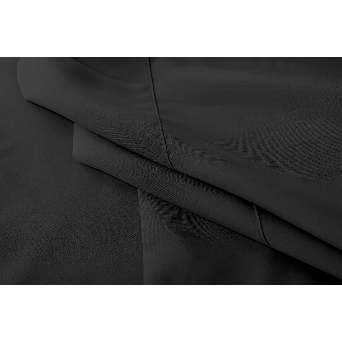 Close-up of black Valeria bed sheet set showing fabric texture and stitching detail