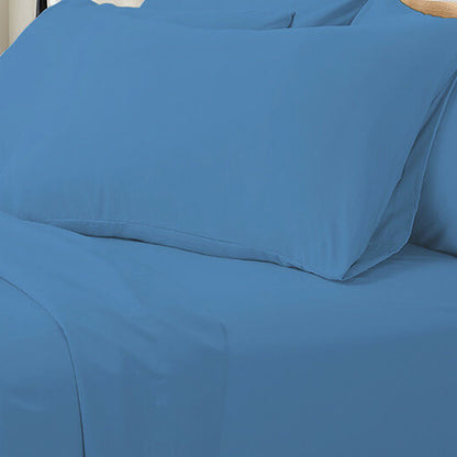 Valeria King 1000TC Ultra Soft Bed Sheet Set in Blue, featuring a close-up of smooth, solid blue bedding with a matching pillowcase on a flat sheet, showcasing luxurious texture and serene style.
