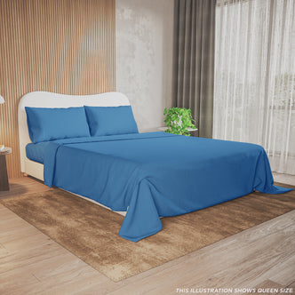 Valeria King Single 1000TC Ultra Soft Bed Sheet Set in Blue showcased on a queen-size bed with blue sheets, matching pillowcases, beside a potted plant, lamp, and books in a serene bedroom setting.