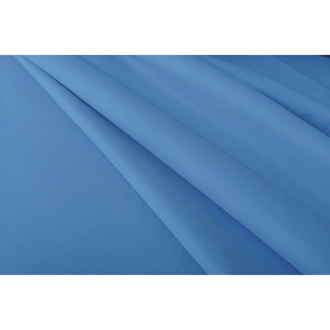 Valeria King Single 1000TC Ultra Soft Bed Sheet Set in Blue, featuring smooth, solid-blue fabric folded in gentle pleats, highlighting its luxurious, plain design and soft texture.
