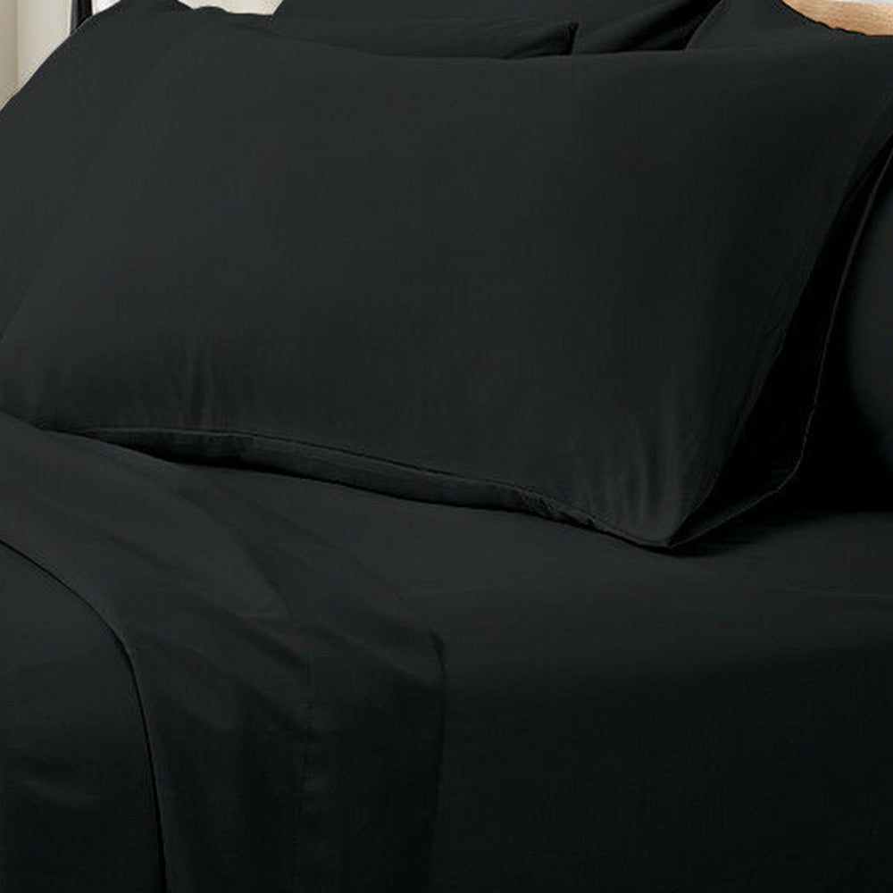Valeria 1000TC Ultra Soft Bed Sheet Set Queen – Black displayed on a bed, showcasing smooth fabric and elegant drape, highlighting its luxurious and wrinkle-free appearance.