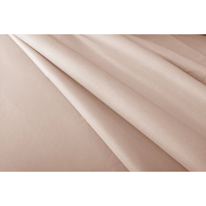 Cream bed sheet fabric with soft folds showing smooth texture and subtle sheen