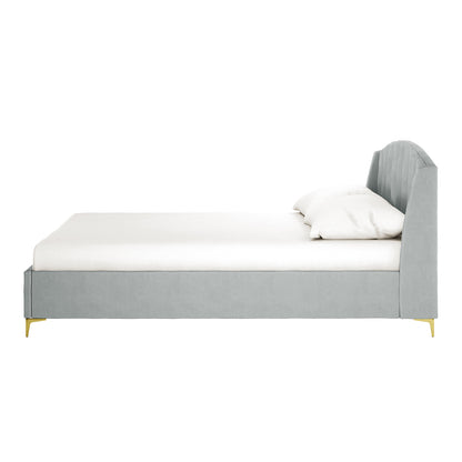 Lyra light grey velvet queen bed frame with winged headboard and gold legs, side view with white mattress and pillows