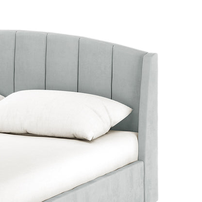 Lyra velvet bed frame with winged headboard in light grey, queen size, shown with white bedding
