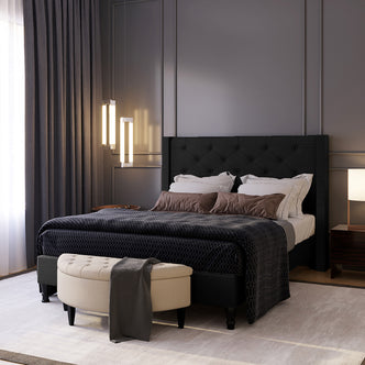 Maggie Double Winged Fabric Bed Frame – Black features a plush, deep-buttoned Chesterfield headboard, providing a sophisticated centerpiece for any bedroom. Sturdy frame design with elegant diamond tufting and timeless aesthetics.