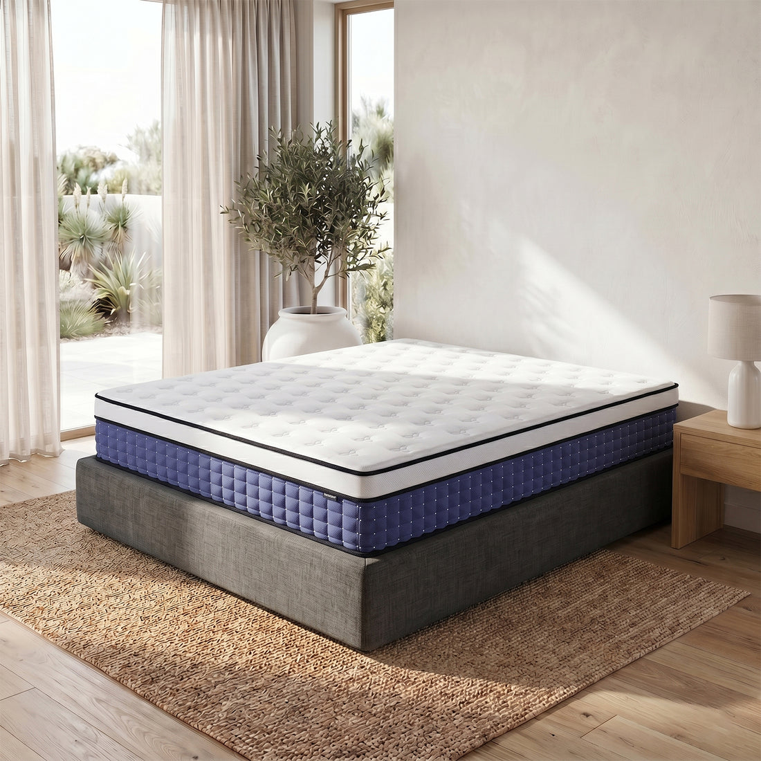 Antheia King 32cm Euro Top Memory Foam Latex Mattress with white quilted top and dark blue tufted sides on grey upholstered