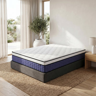 Antheia queen mattress with white quilted top and purple checkered side panel on grey bed base