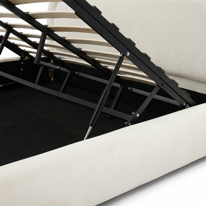 Cream white upholstered gas lift storage bed frame with black metal mechanism and wooden slats raised to reveal under-bed