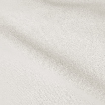 Cream white velvet upholstered bed frame with gas lift storage mechanism, close-up of textured fabric upholstery