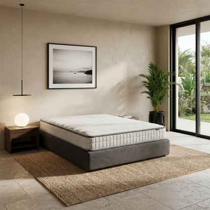 Cybele Queen 20cm Pocket Spring Memory Foam Mattress with quilted white top and grey piped edges on a grey upholstered base