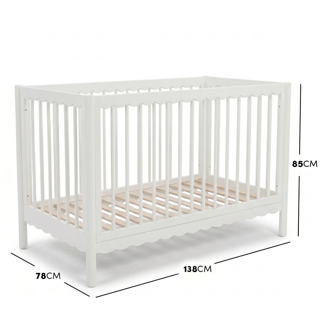 White timber baby cot with scalloped base molding and dimensions diagram.